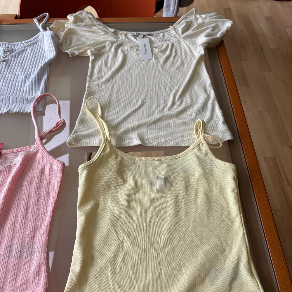 8 Tank tops many with tags size m.  Sell as bundle $80 or individual $15